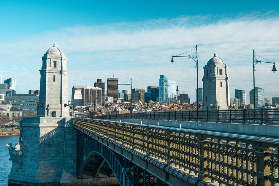 A stunning view of the Longfellow Bridge with Boston's skyline in the background, captured on a bright day.