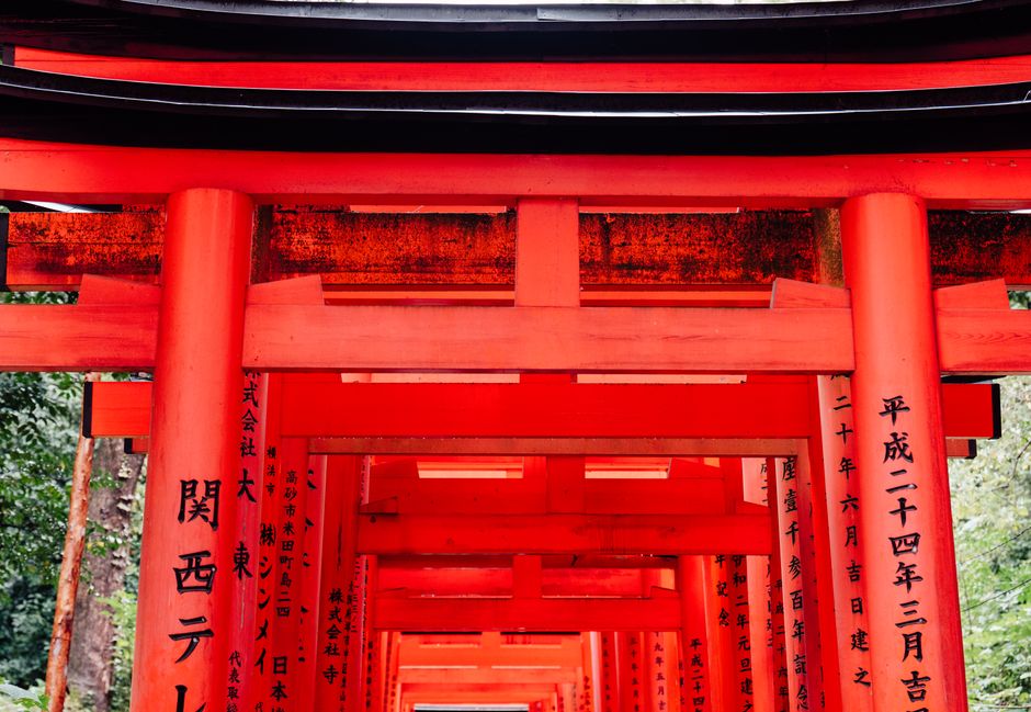 Explore the vibrant red Torii gates of Fushimi Inari Taisha in Kyoto, Japan, an iconic cultural landmark.
